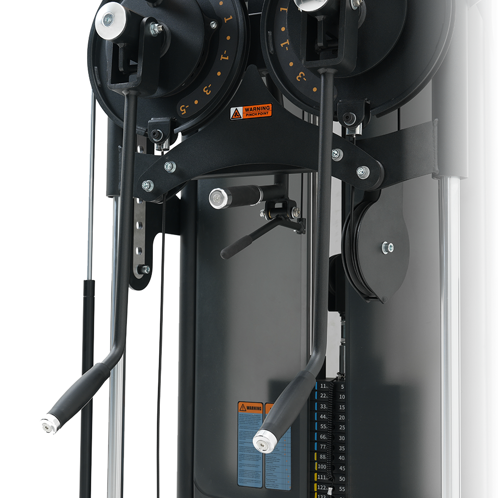 Close-up of a gym machine with pulleys and weight settings on a white background